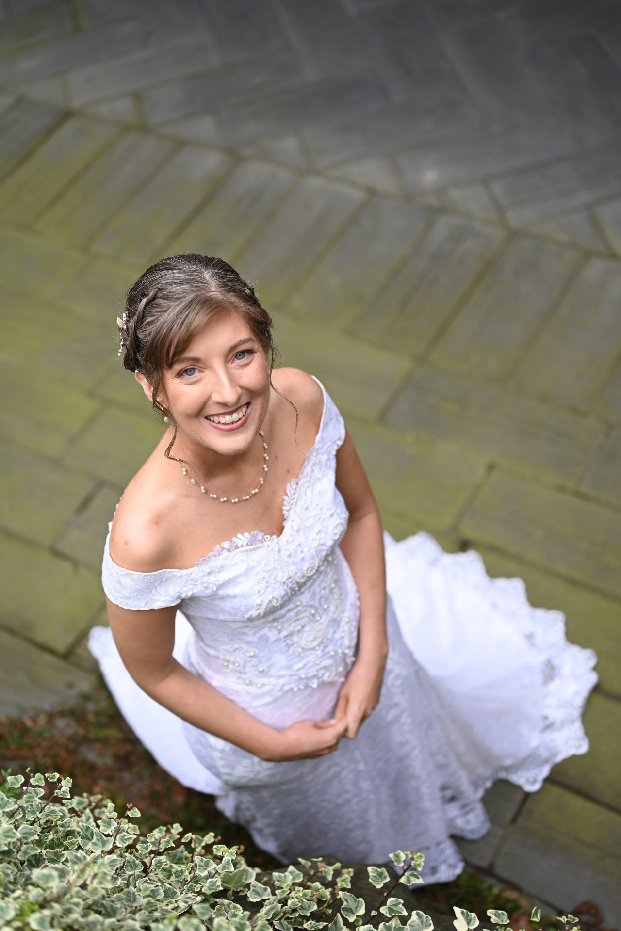 Bride twirling her gown on a herringbone path