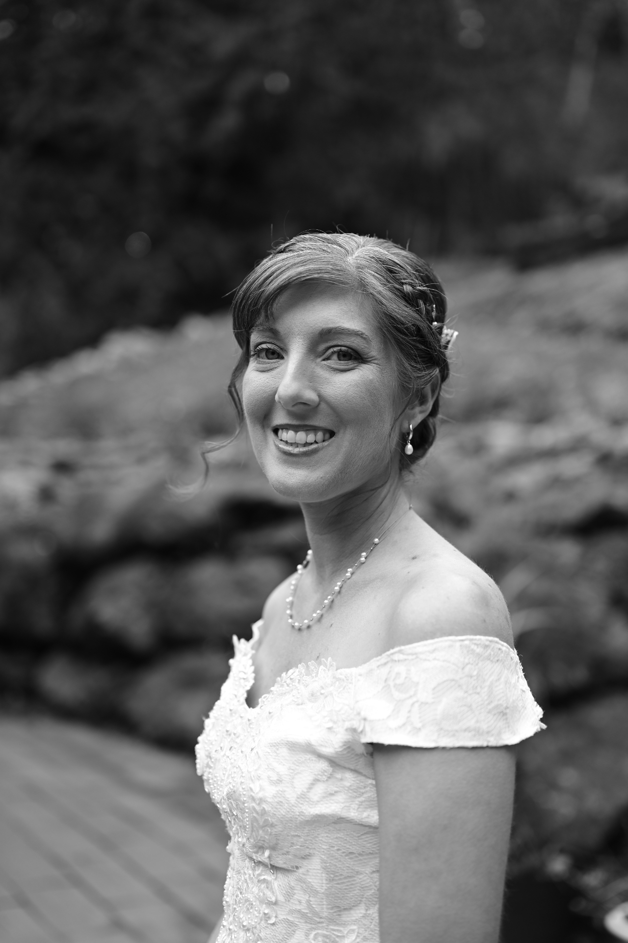Black and white bridal portrait by the rocks