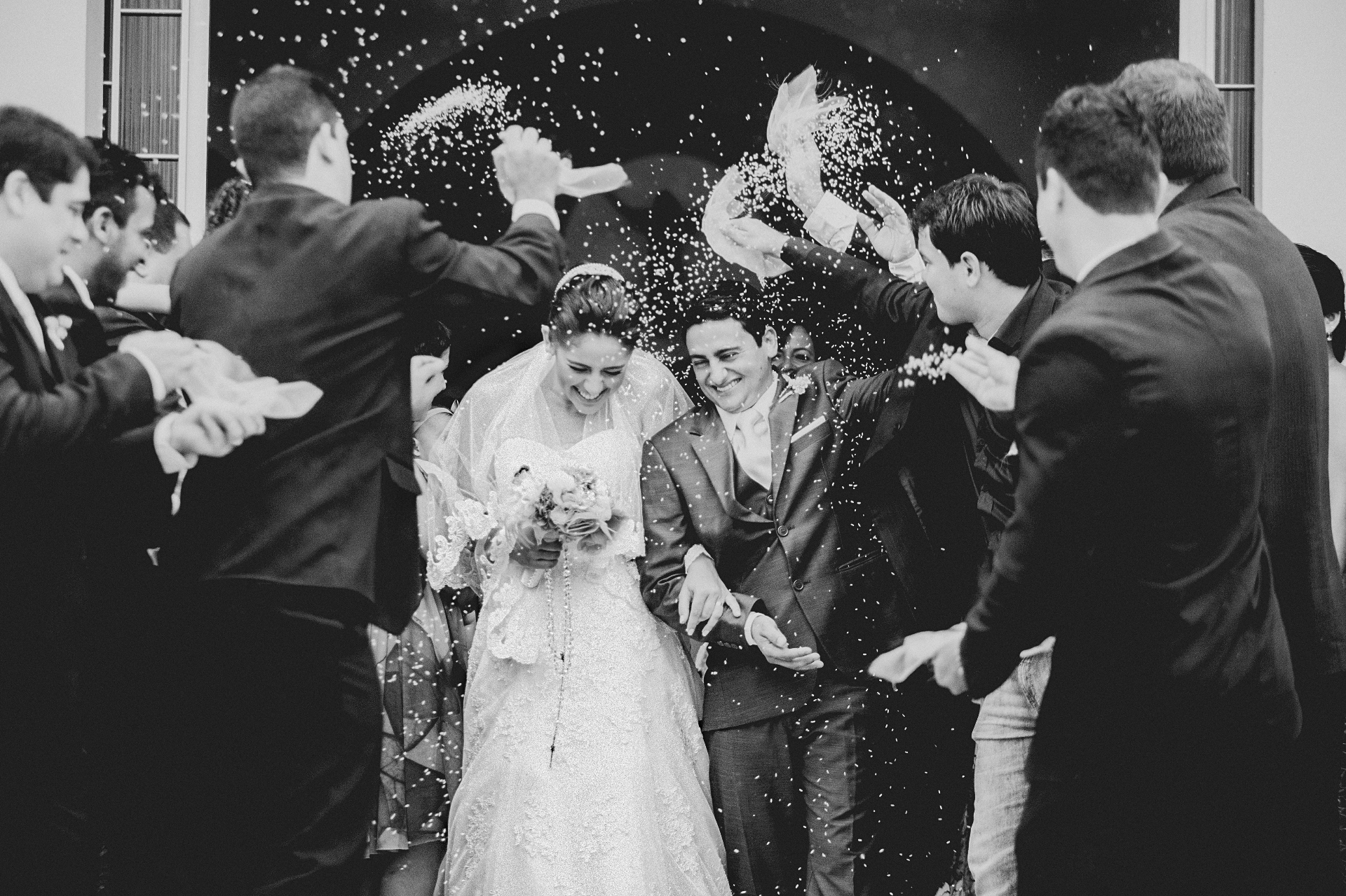Black and white wedding exit with rice toss
