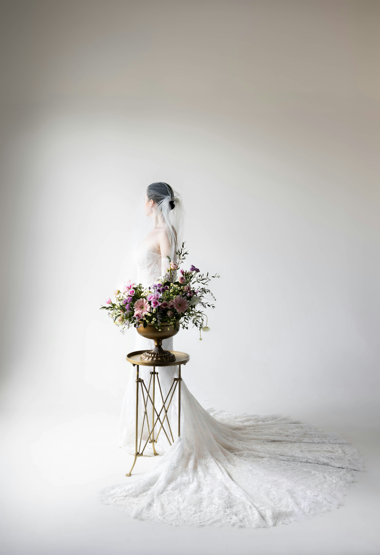 Editorial bride portrait with floral arrangement